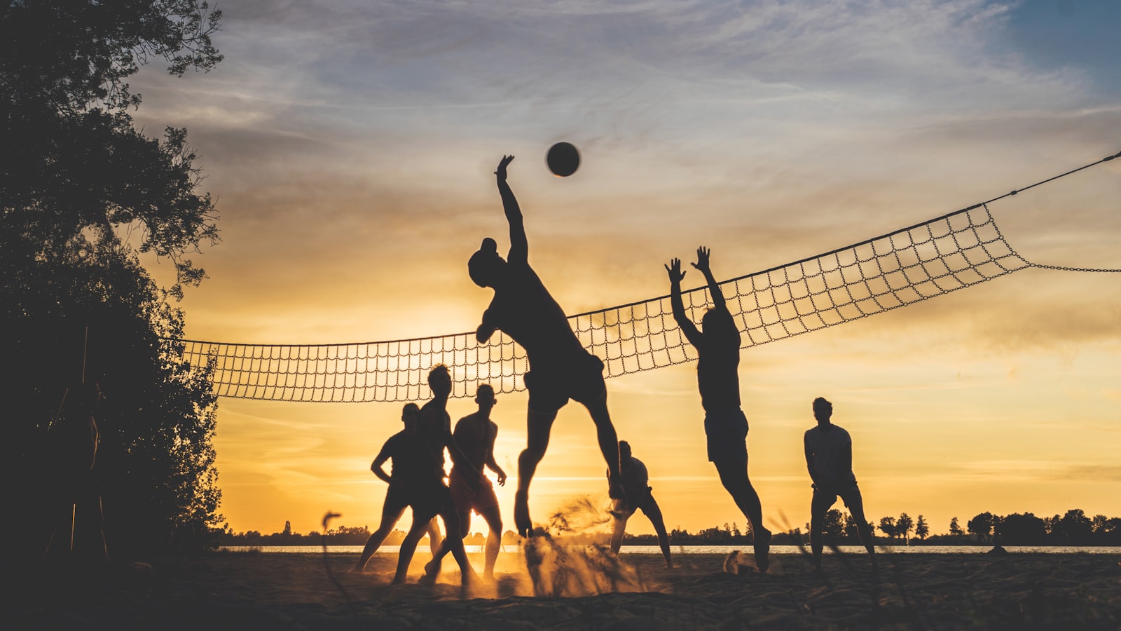 Volleyball players in action at a TDVC league game